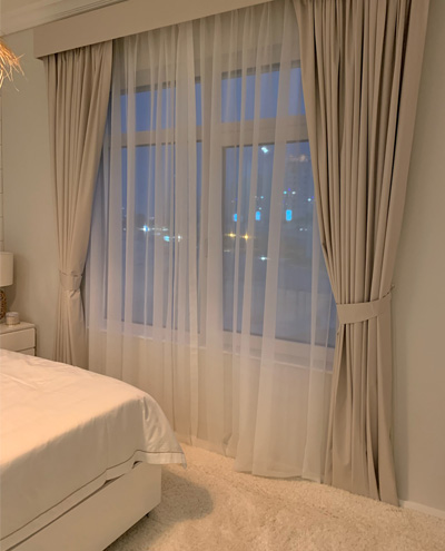 beige-and-white-curtains-in-bedroom