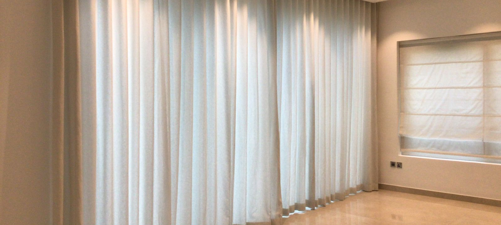 white-curtains-in-empty-room